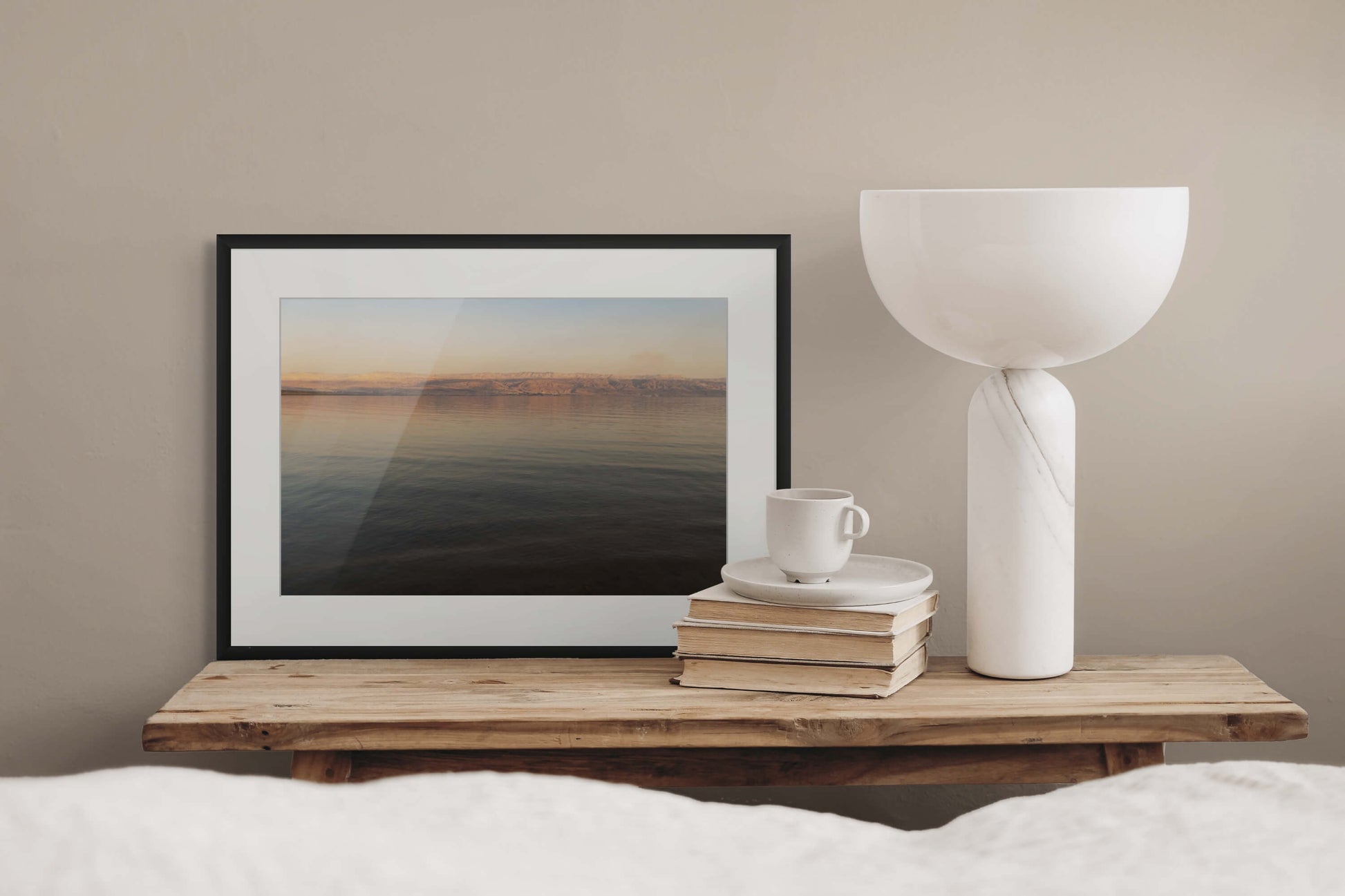 Dead Sea Water II by Erica Goldemberg with black frame in a bedroom mockups