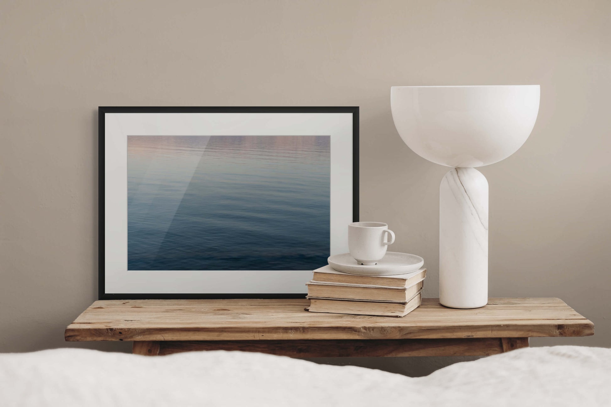 Dead Sea Water I by Erica Goldemberg with black frame in a bedroom mockups